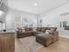 Spacious living room with large windows and comfortable sectional sofa at 117 Wonder Sol Way, Summerville, SC 29485
