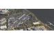 Aerial view of community near the water, featuring various buildings and landscaping at 130 River Landing Dr # 7210, Daniel Island, SC 29492