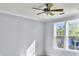 Well-lit bedroom with large windows and ceiling fan at 130 River Landing Dr # 7210, Daniel Island, SC 29492