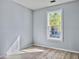 Spacious bedroom with large window and light wood floors at 130 River Landing Dr # 7210, Daniel Island, SC 29492