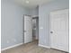 Bright bedroom with wood-look floors and access to laundry at 130 River Landing Dr # 7210, Daniel Island, SC 29492