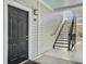 Apartment building exterior showcasing a private entrance and exterior staircase at 130 River Landing Dr # 7210, Daniel Island, SC 29492