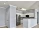 Modern kitchen with stainless steel appliances and white cabinets at 130 River Landing Dr # 7210, Daniel Island, SC 29492