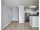 Open living room and kitchen area with wood-look floors at 130 River Landing Dr # 7210, Daniel Island, SC 29492