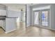 Bright living room with hardwood floors and access to a private balcony at 130 River Landing Dr # 7210, Daniel Island, SC 29492