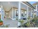 Inviting front porch featuring rocking chairs and landscaping at 1332 Clay Field Trl, Summerville, SC 29485