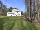 Large backyard with grassy lawn and wooded backdrop at 1421 Brownswood Rd, Johns Island, SC 29455