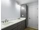 Double vanity bathroom with dark grey cabinets and marble countertop at 1421 Brownswood Rd, Johns Island, SC 29455