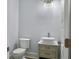 Modern bathroom with pedestal sink, toilet and updated fixtures at 1421 Brownswood Rd, Johns Island, SC 29455
