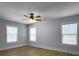 Simple bedroom with light walls, hardwood floors, and ceiling fan at 1421 Brownswood Rd, Johns Island, SC 29455