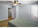Bedroom with ceiling fan and access to a hallway at 1421 Brownswood Rd, Johns Island, SC 29455