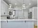 Modern kitchen, white cabinets, marble countertops, stainless steel appliances at 1421 Brownswood Rd, Johns Island, SC 29455