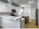 Modern kitchen with white cabinets, center island, and stainless steel appliances at 1421 Brownswood Rd, Johns Island, SC 29455
