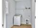 Laundry room with washer, dryer, and overhead shelving at 1421 Brownswood Rd, Johns Island, SC 29455