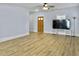Spacious living room featuring hardwood floors and a large TV at 1421 Brownswood Rd, Johns Island, SC 29455