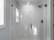 Bright walk-in shower with glass doors and white tile at 1421 Brownswood Rd, Johns Island, SC 29455