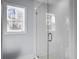 Large walk-in shower with glass enclosure and white tile at 1421 Brownswood Rd, Johns Island, SC 29455