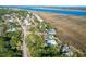 Aerial view of upscale waterfront community with luxurious homes and lush landscaping at 1563 Headquarters Plantation Dr, Johns Island, SC 29455