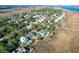 Aerial view of upscale waterfront community with luxurious homes and lush landscaping at 1563 Headquarters Plantation Dr, Johns Island, SC 29455