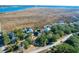 Bird's-eye view of waterfront property with marsh views and neighboring homes at 1563 Headquarters Plantation Dr, Johns Island, SC 29455