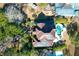 House with solar panels, pool, and tropical landscaping, seen from above at 1563 Headquarters Plantation Dr, Johns Island, SC 29455