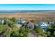 Aerial view of waterfront homes with marsh views at 1563 Headquarters Plantation Dr, Johns Island, SC 29455