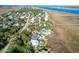 Aerial view of upscale waterfront community with luxurious homes and lush landscaping at 1563 Headquarters Plantation Dr, Johns Island, SC 29455