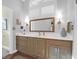 Bathroom with wood vanity, quartz countertop, and large mirror at 1563 Headquarters Plantation Dr, Johns Island, SC 29455