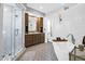 Elegant bathroom with a soaking tub, walk-in shower, and modern double vanity at 1563 Headquarters Plantation Dr, Johns Island, SC 29455