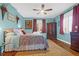 Bright bedroom with hardwood floors and colorful decor at 1563 Headquarters Plantation Dr, Johns Island, SC 29455