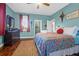 Relaxing bedroom with hardwood floors and ensuite bathroom at 1563 Headquarters Plantation Dr, Johns Island, SC 29455