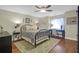 Cozy bedroom with a metal bed frame, desk and wood floors at 1563 Headquarters Plantation Dr, Johns Island, SC 29455