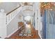 Elegant entryway with hardwood floors and staircase at 1563 Headquarters Plantation Dr, Johns Island, SC 29455