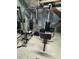 A home gym with free weights and machines for exercise in the basement of the home at 1563 Headquarters Plantation Dr, Johns Island, SC 29455
