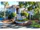 Two story home with gray siding, brown roof, and landscaped yard at 1563 Headquarters Plantation Dr, Johns Island, SC 29455