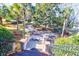 Landscaped front yard with stairs leading to home and lush tropical foliage at 1563 Headquarters Plantation Dr, Johns Island, SC 29455