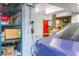 Garage with electric car charger and storage shelving at 1563 Headquarters Plantation Dr, Johns Island, SC 29455