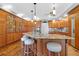 Large kitchen with granite island, wood cabinets, and stainless steel appliances at 1563 Headquarters Plantation Dr, Johns Island, SC 29455