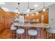 Spacious kitchen with granite island, wood cabinets, and breakfast bar at 1563 Headquarters Plantation Dr, Johns Island, SC 29455