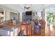 Spacious living room with hardwood floors, fireplace, and ample natural light at 1563 Headquarters Plantation Dr, Johns Island, SC 29455