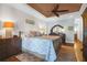Main bedroom with ceiling fan, wood flooring and plenty of natural light at 1563 Headquarters Plantation Dr, Johns Island, SC 29455