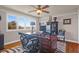 Home office with built-in shelving and hardwood floors at 1563 Headquarters Plantation Dr, Johns Island, SC 29455