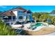 Luxury pool and spa with patio furniture and umbrellas at 1563 Headquarters Plantation Dr, Johns Island, SC 29455