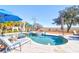 Inviting kidney-shaped pool with spa and lounge chairs; umbrellas and marsh views at 1563 Headquarters Plantation Dr, Johns Island, SC 29455