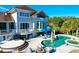 Luxury pool and spa with patio furniture and umbrellas at 1563 Headquarters Plantation Dr, Johns Island, SC 29455