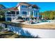 Luxury pool and spa with patio furniture and umbrellas at 1563 Headquarters Plantation Dr, Johns Island, SC 29455
