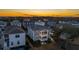 Aerial view of upscale homes at sunset, showcasing community and water features at 1646 Red Tide Rd, Mount Pleasant, SC 29466