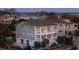 Elevated view of a two-story house, showcasing its architectural details and landscaping at 1646 Red Tide Rd, Mount Pleasant, SC 29466