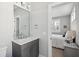 Contemporary bathroom featuring a gray vanity and white countertop, with a bedroom visible at 1646 Red Tide Rd, Mount Pleasant, SC 29466