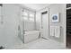 Modern bathroom features a soaking tub and a walk-in shower at 1646 Red Tide Rd, Mount Pleasant, SC 29466